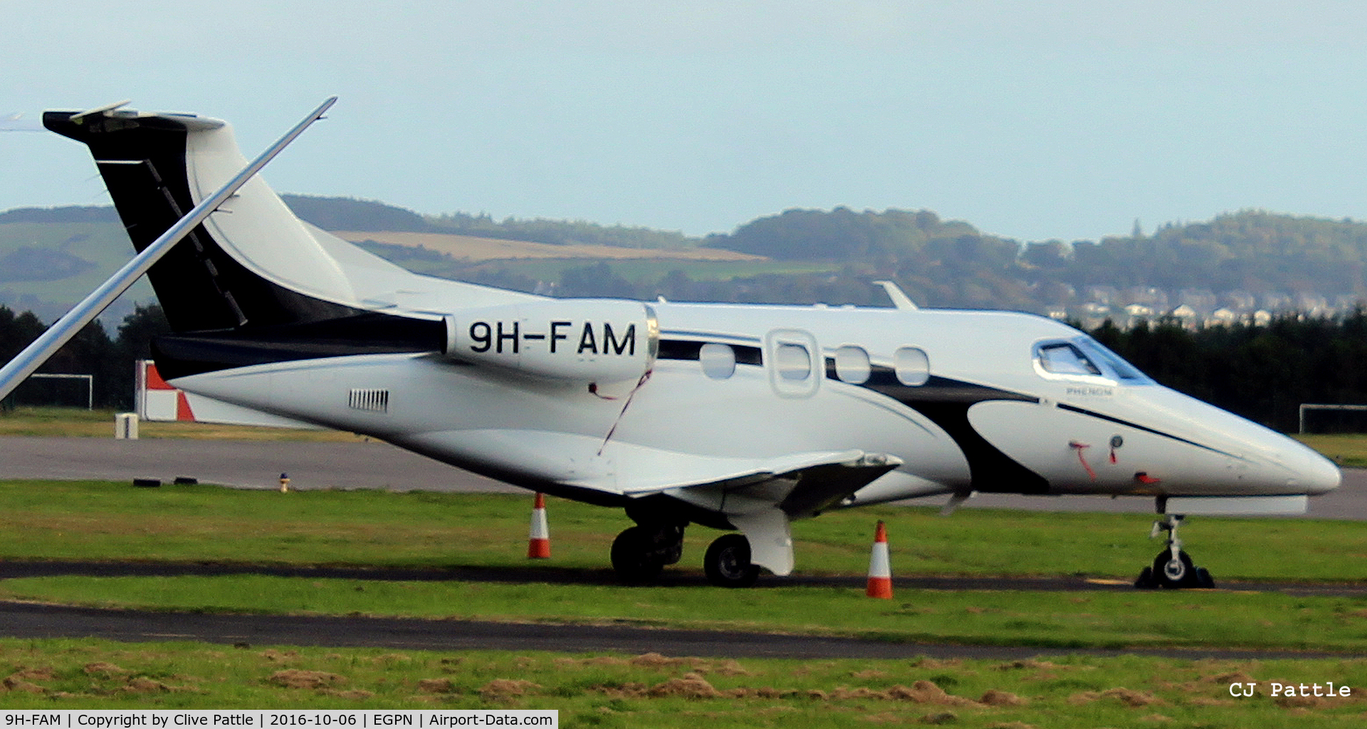 9H-FAM, 2009 Embraer EMB-500 Phenom 100 C/N 50000100, At Dundee Riverside Airport EGPN, slightly obscured,  for the Annual Golf Dunhill Links Championships, held at nearby St Andrews.