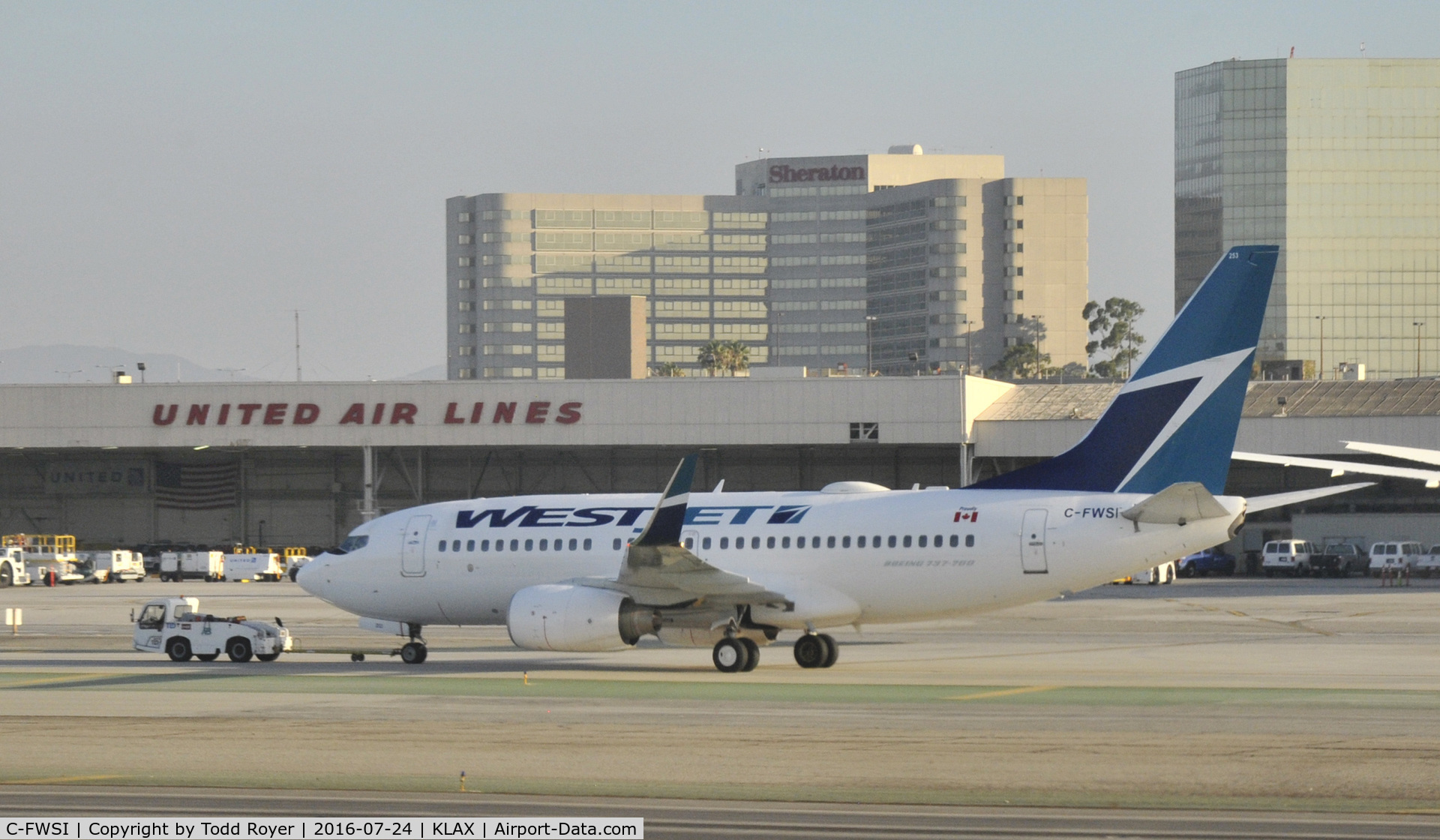 C-FWSI, 2009 Boeing 737-7CT C/N 36691, Getting towed at LAX