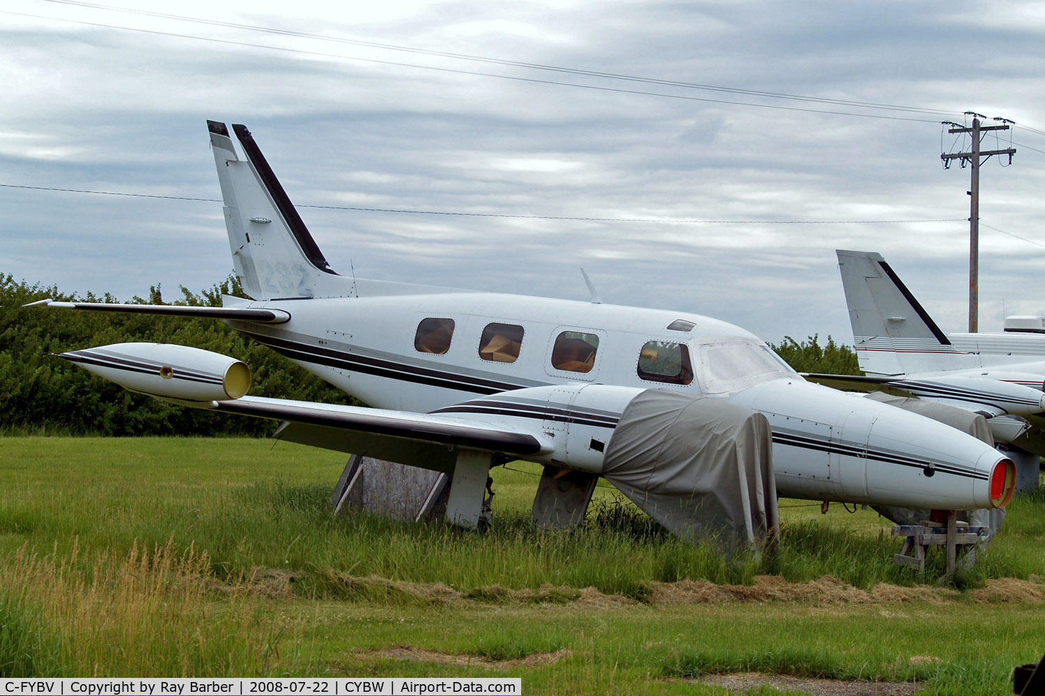 C-FYBV, 1975 Piper PA-31T Cheyenne II C/N 31T-7520015, Piper PA-31T Cheyenne II [31T-7520015] (MWT Aerospace) Calgary-Springbank~C 22/07/2008. Cancelled 03/10/2008 seen stored here for spares use. Seen still wearing former marks of N11232 partially painted out.