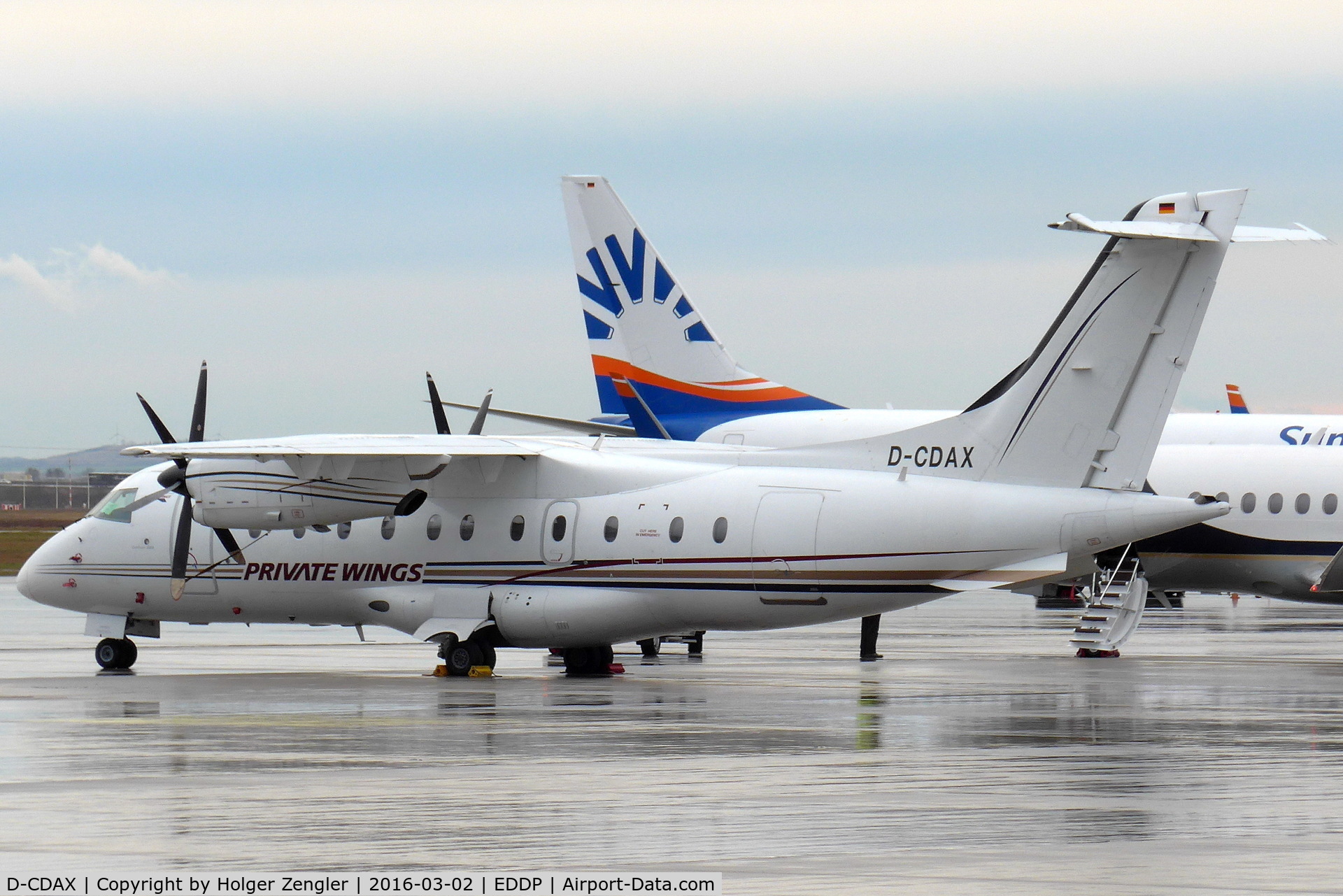 D-CDAX, 1998 Dornier 328-100 C/N 3087, Apron 1 east is crowded and pretty wet....