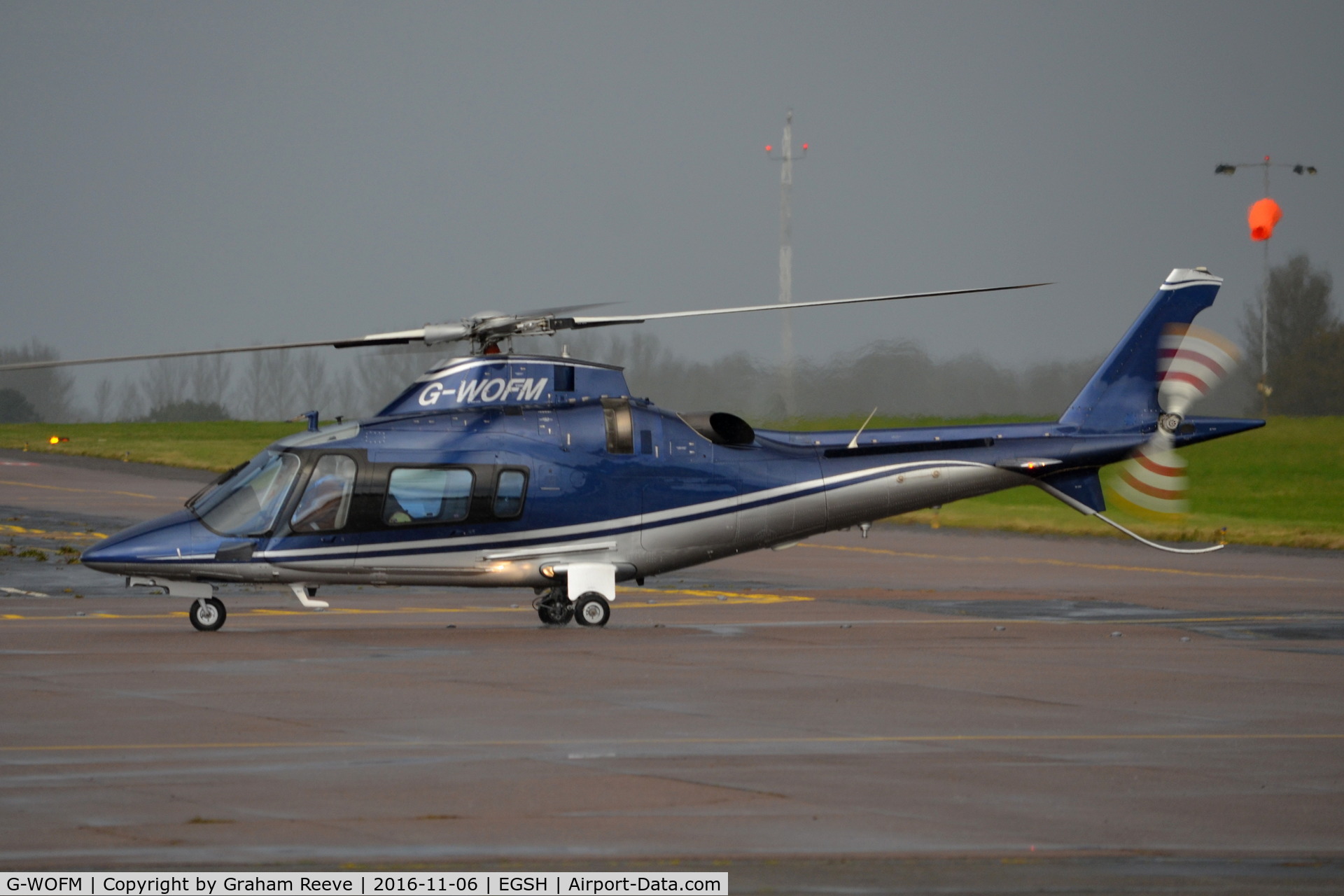 G-WOFM, 2006 Agusta A-109E Power C/N 11678, Just landed at Norwich in heavy rain.