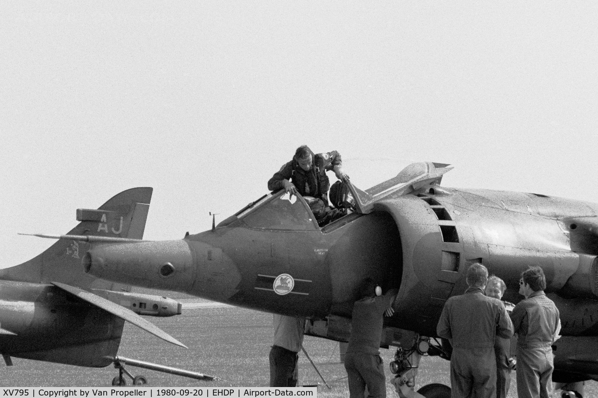 XV795, 1970 Hawker Siddeley Harrier GR.3 C/N 712045, Harrier GR.3 of RAF 3 squadron at De Peel air base, the Netherlands, 1980. The pilot is climbing in and the crew-chief is checking the engine air intake