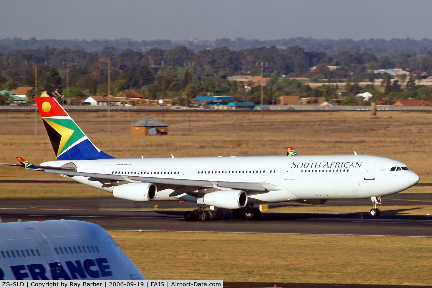 ZS-SLD, 1993 Airbus A340-211 C/N 019, Airbus A340-212 [019] (South African Airways) Johannesburg Int~ZS 19/09/2006. Taken through the glass of the terminal.