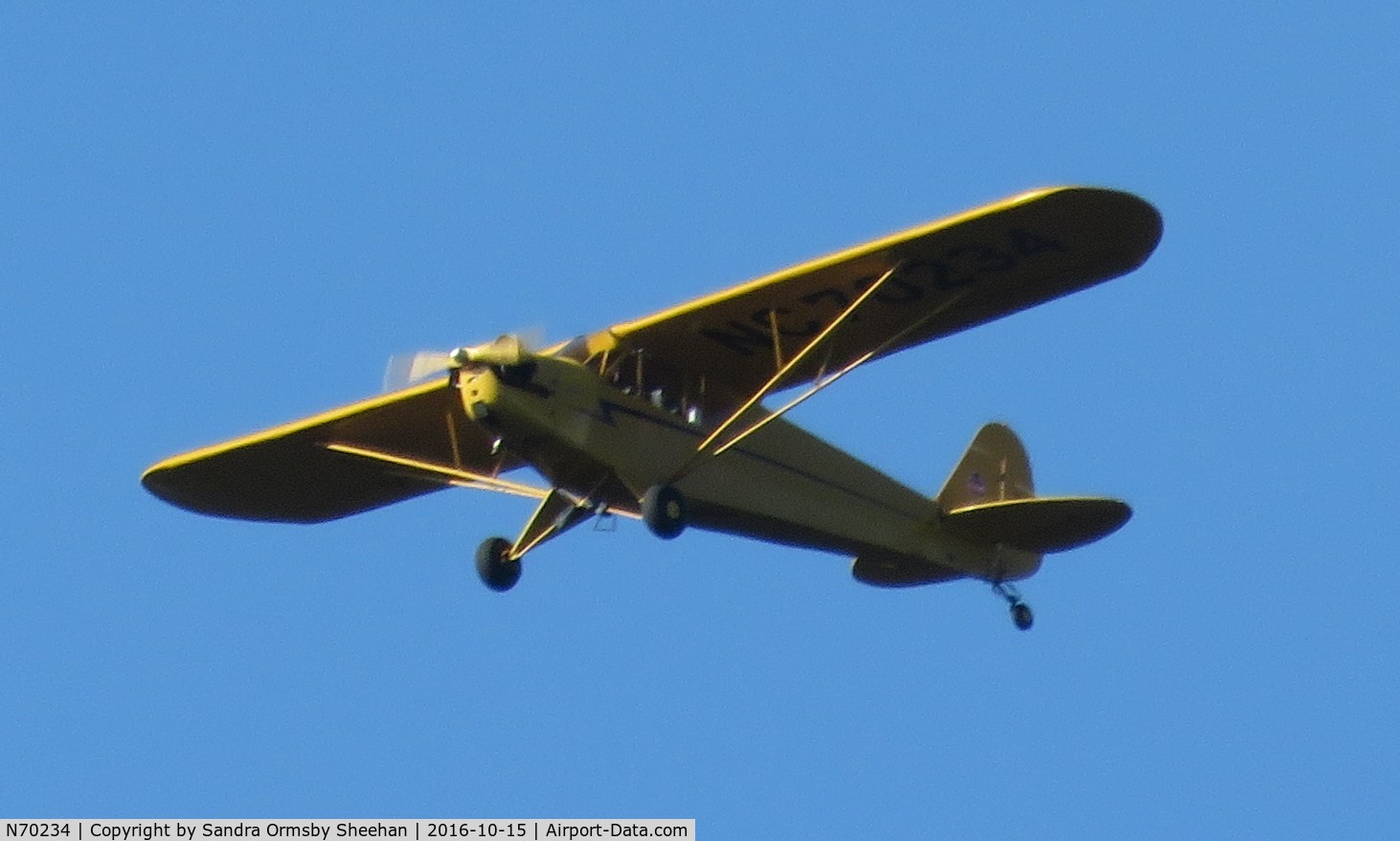 N70234, 1946 Piper J3C-65 Cub Cub C/N 17210, Flying over Mastic NY.