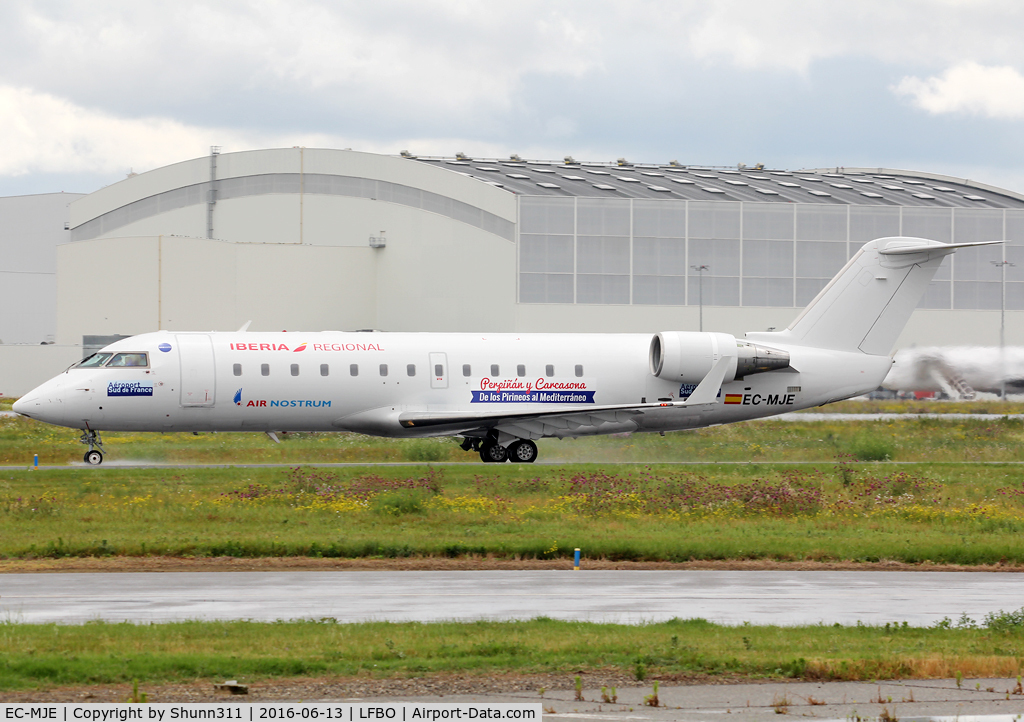 EC-MJE, 2002 Bombardier CRJ-200ER (CL-600-2B19) C/N 7622, Taxiing holding point rwy 32R for departure... additional titles