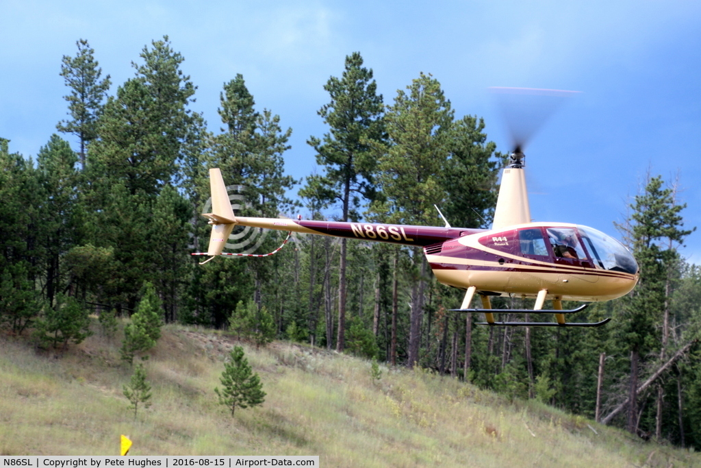 N86SL, 2004 Robinson R44 II C/N 10375, N86SL R44 departing a roadside helipad near Custer SD