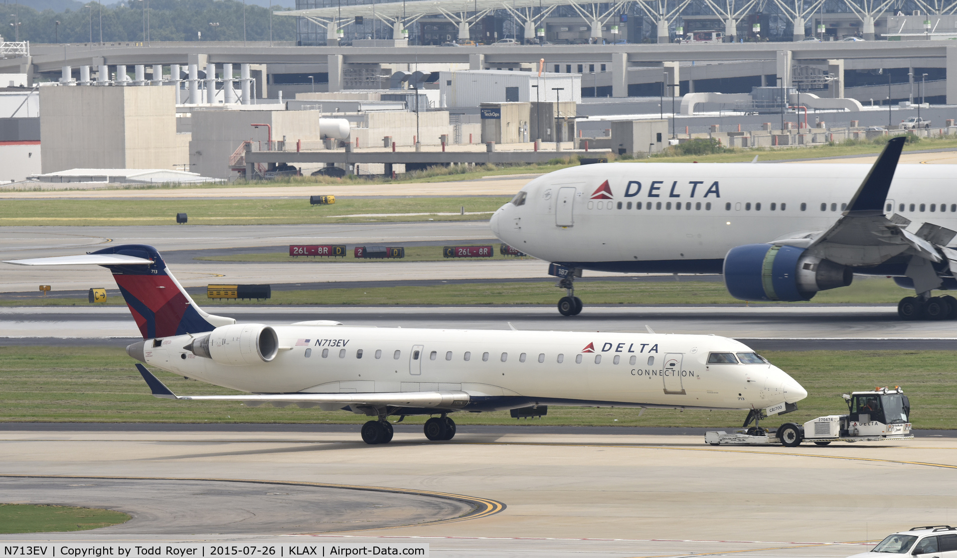 N713EV, 2003 Bombardier CRJ-701 (CL-600-2C10) Regional Jet C/N 10081, Taxiing to parking at Atlanta