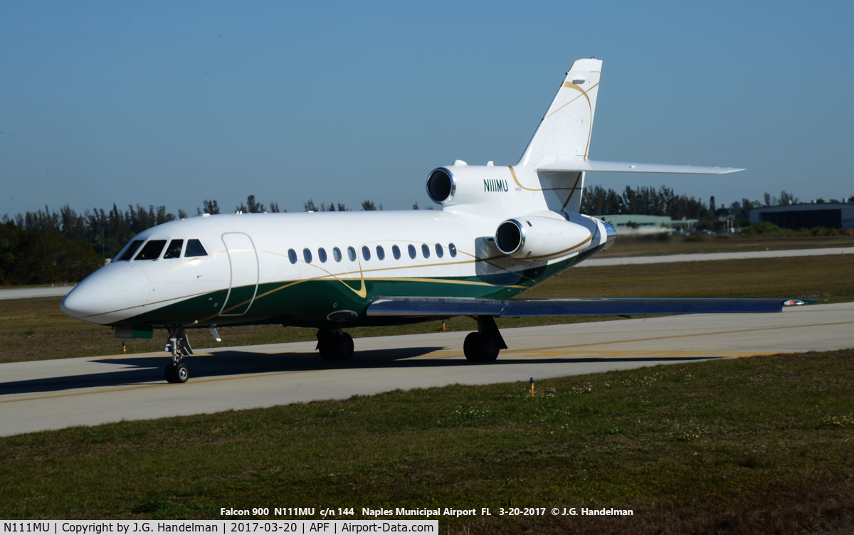 N111MU, 1994 Beech C90A King Air C/N LJ-1367, Falcon 900 taxiing to take off.