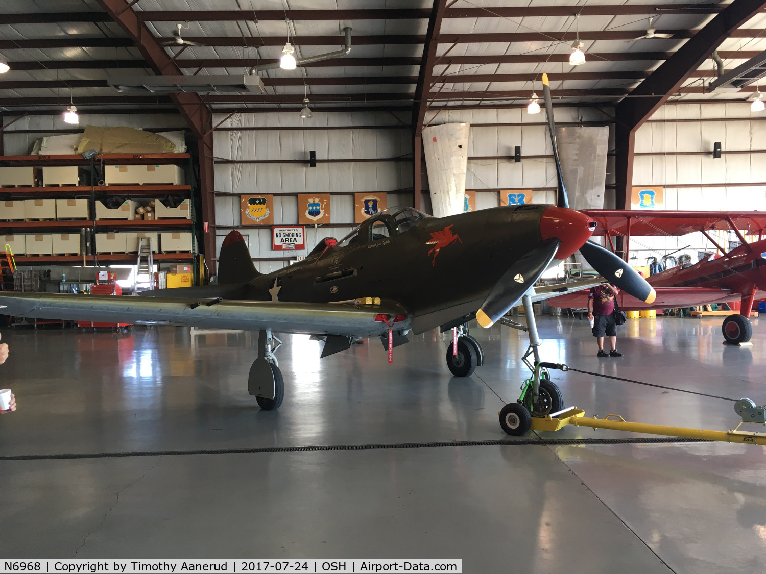 N6968, 1943 Bell P-39Q Airacobra C/N 219597, Getting towed out of the hangar after it's nose wheel was serviced. 1943 Bell P-39Q Airacobra, c/n: 219597