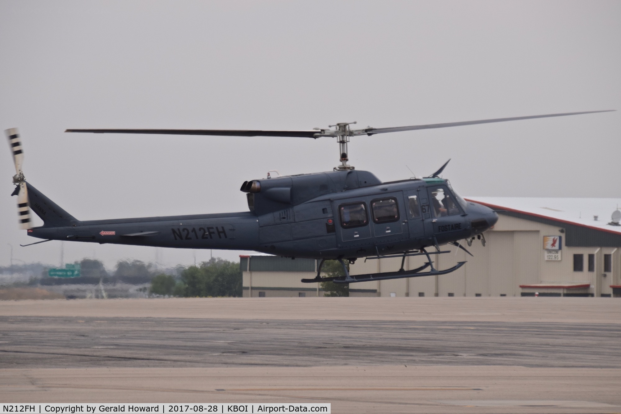 N212FH, Bell 212 C/N 3026, Landing on north GA ramp.