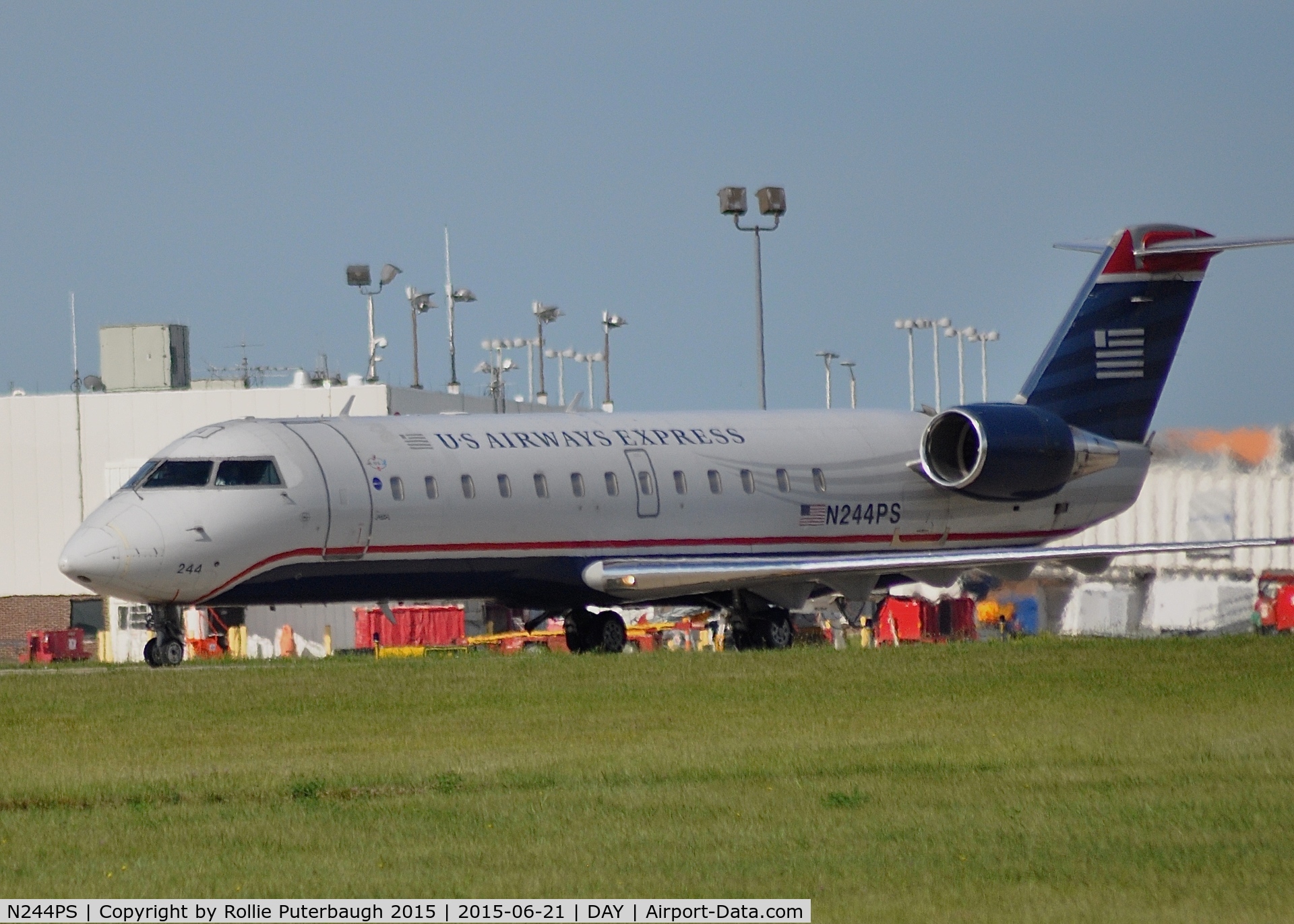 N244PS, 2004 Bombardier CRJ-200ER (CL-600-2B19) C/N 7912, PSA Airlines Canadair Regional Jet CRJ-200ER {N244PS}, operating as U.S Airways Express, heads towards Runway 24 Left at the Dayton International Airport {DAY} bound for the Charlotte/Douglas International Airport on June 21, 2015.