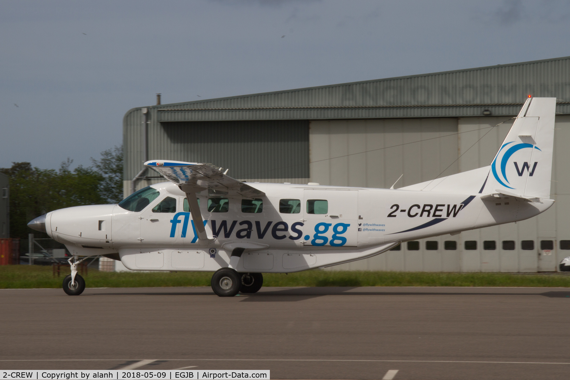 2-CREW, 2009 Cessna 208B Grand Caravan C/N 208B2148, Taxiing on the west apron at Guernsey, Liberation Day, 2018
