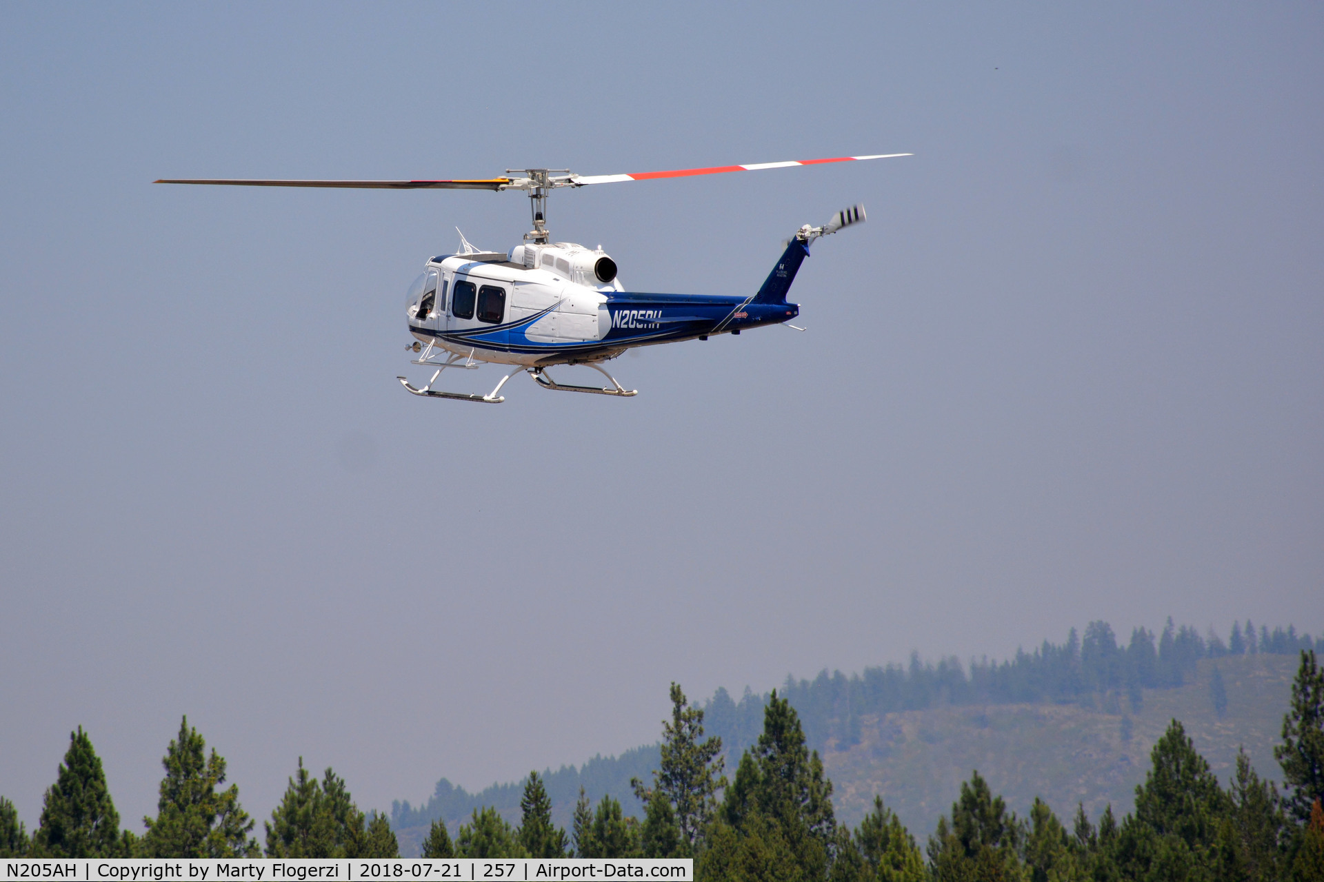 N205AH, Bell 205A-1 C/N 30206, Over the Airport in Chiloquin, Oregon during the adjacent Crater Lake Stampede Rodeo. 21 July 2018.