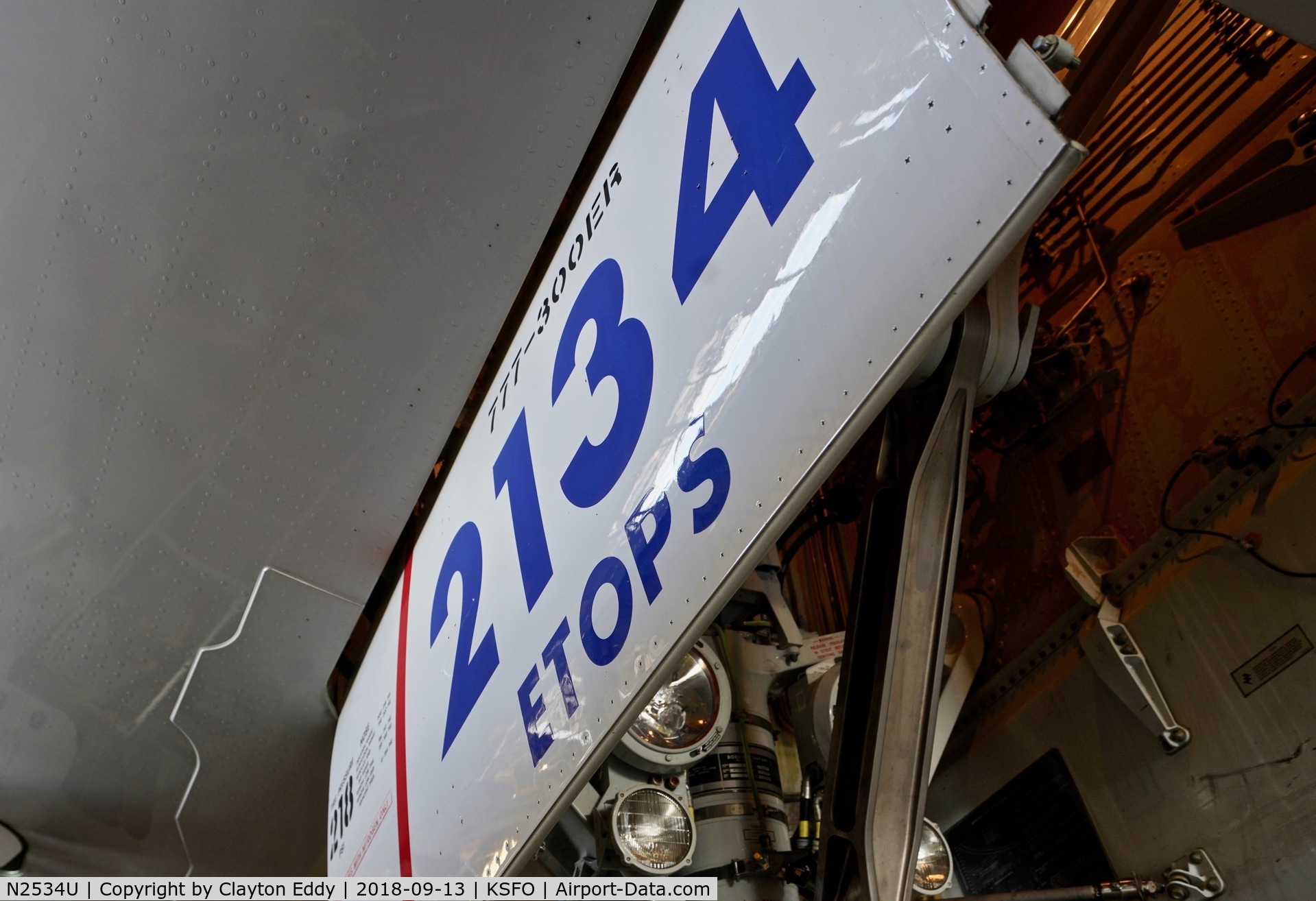 N2534U, 2017 Boeing 777-300/ER C/N 62645, Nose landing gear door. SFO 2018.