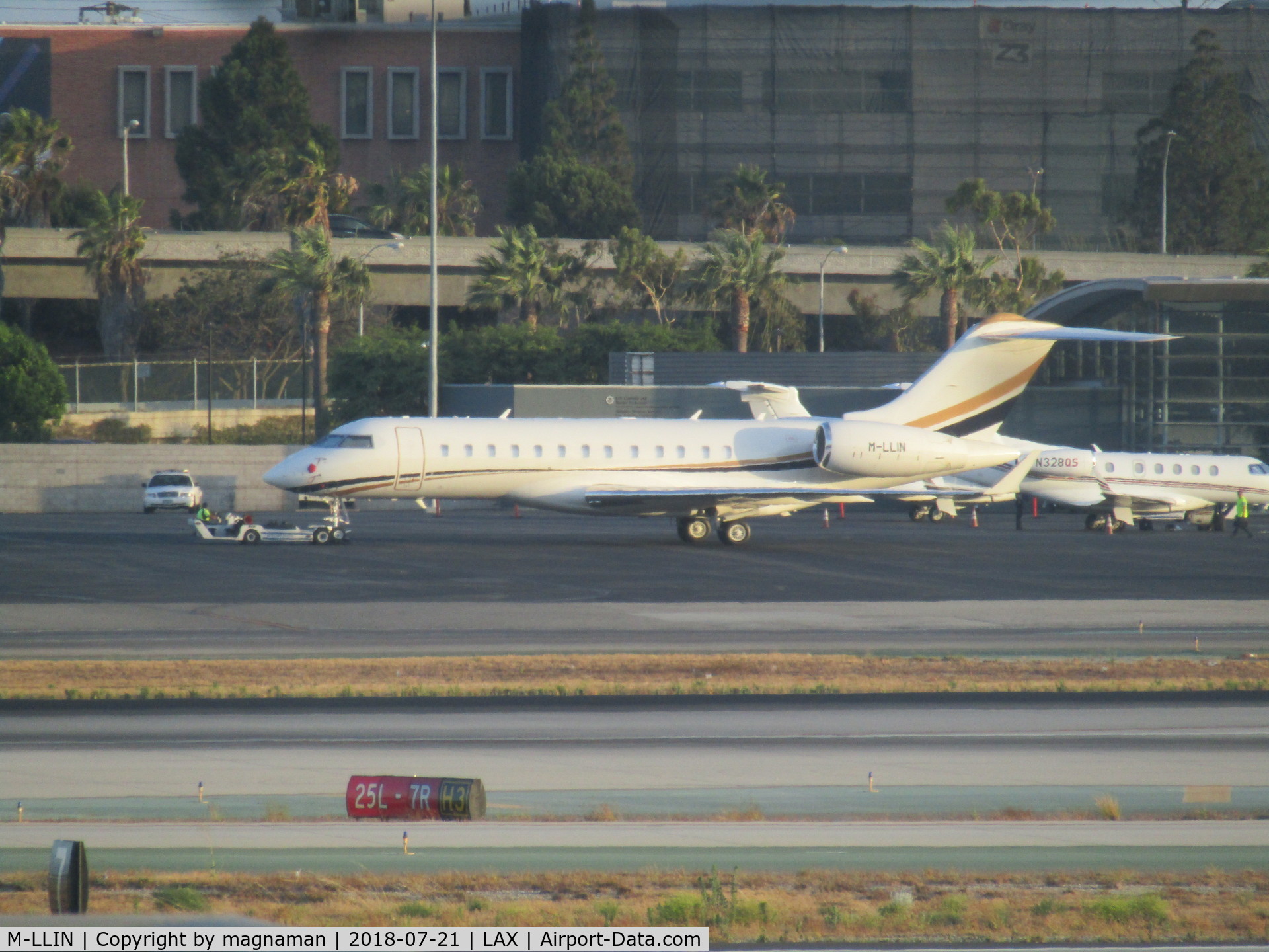 M-LLIN, 2015 Bombardier BD-700-1A10 Global 6000 C/N 9735, being towed to stand