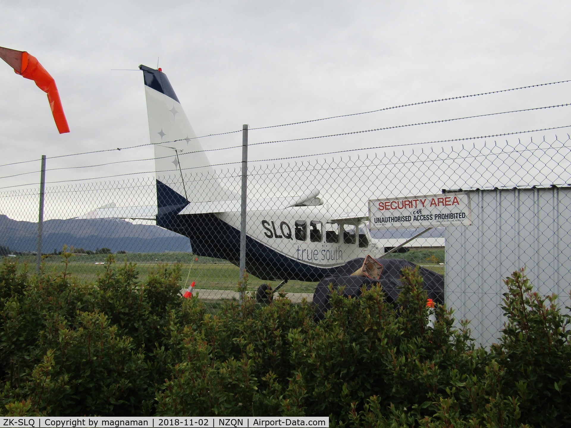 ZK-SLQ, Gippsland GA-8 Airvan C/N GA8-03-040, from cafe seating area opposite terminal side of airfield