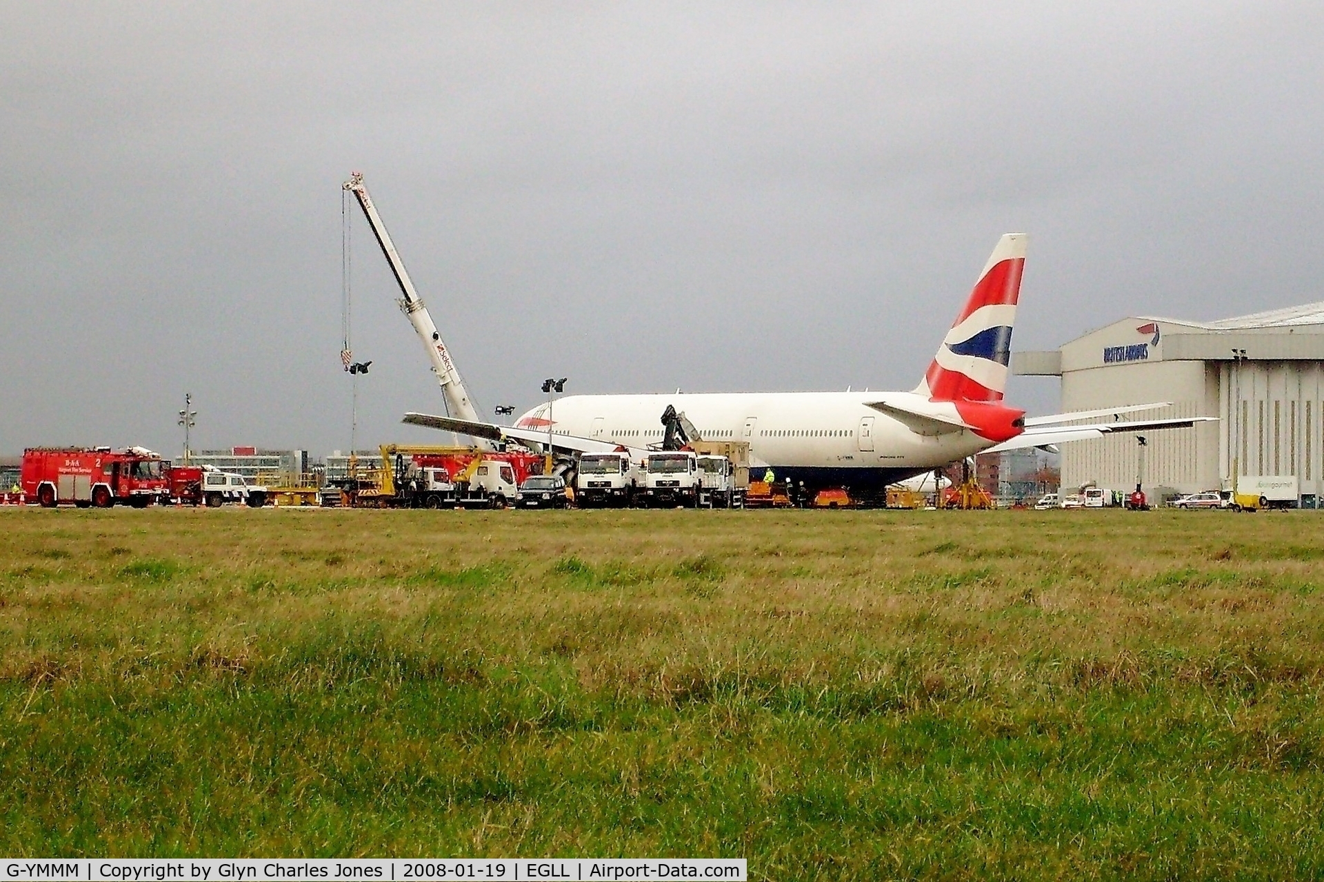 G-YMMM, 2001 Boeing 777-236/ER C/N 30314/342, Two days after the miraculous crash landing on 17th January 2008 whilst operating British Airways flight BA038 from Beijing and the crane has lifted the left wing. It has now been written off and broken up at London-Heathrow in 2009.