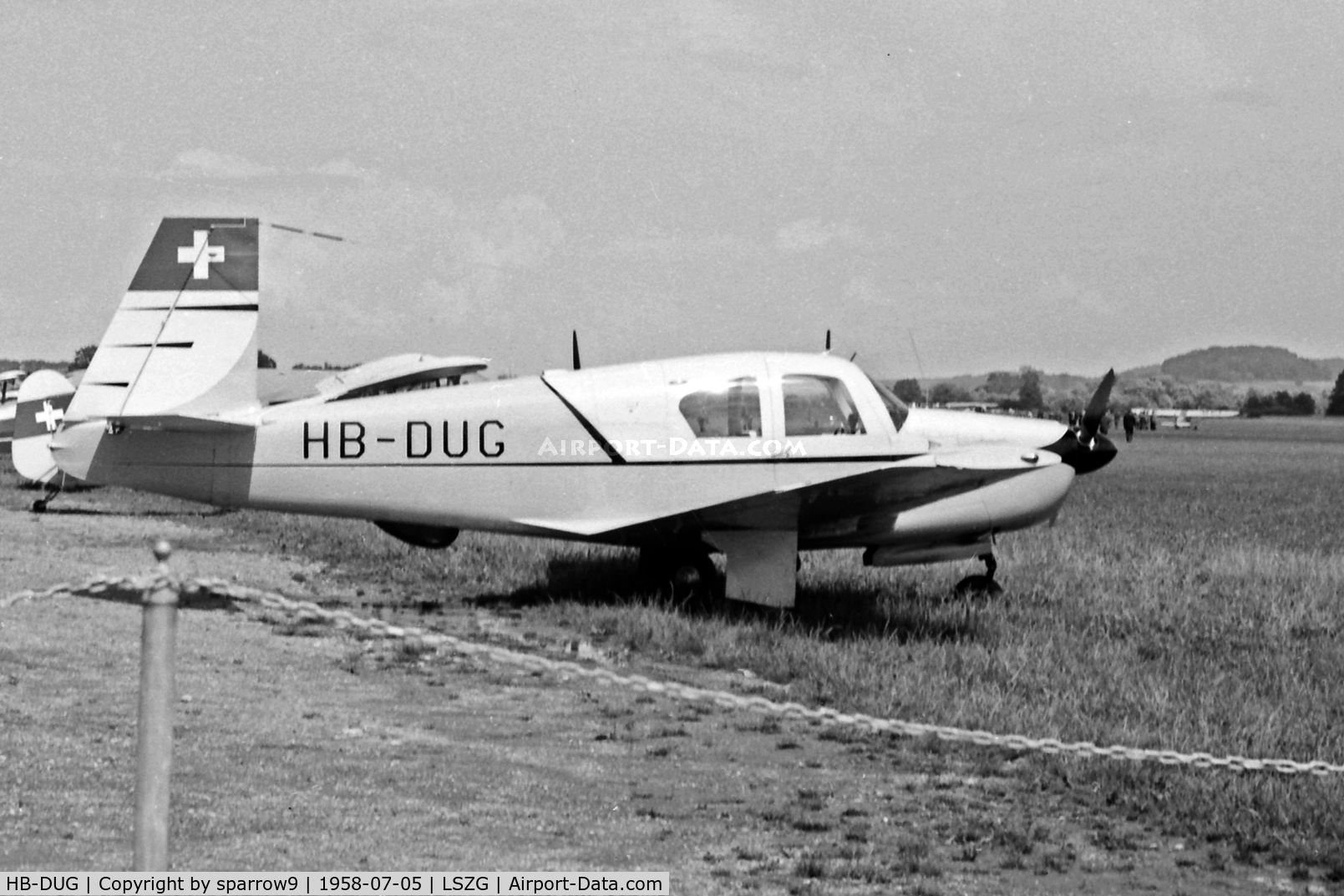 HB-DUG, 1958 Mooney M20 C/N 1194, This plane was delivered from Kerrville to Zurich via South Amerca, the South Atlantic and the African West Coast in 80h 29 min. When the photo was made 106 engine-hours were shown. Scanned from a 6x9cm b+w negative.
