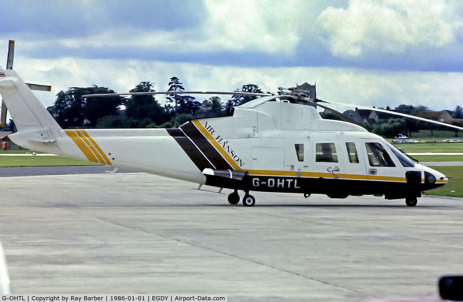 G-OHTL, 1980 Sikorsky S-76A C/N 760040, G-OHTL   Sikorsky S-76A+ [760040] (Air Hanson) RNAS Yeovilton~G @ 1986. From a slide.