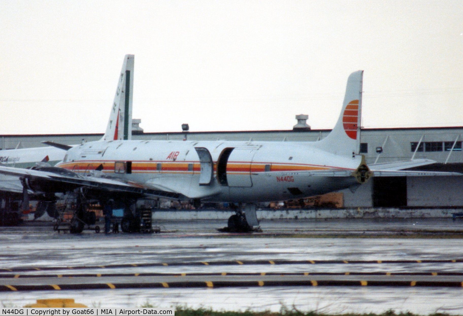 N44DG, 1957 Douglas DC-6A C/N 45373, Awaiting attention at MIA during March 1990 and displaying the part titlle and colours of a previous opertator, PAT (Petroleum Air Transport)