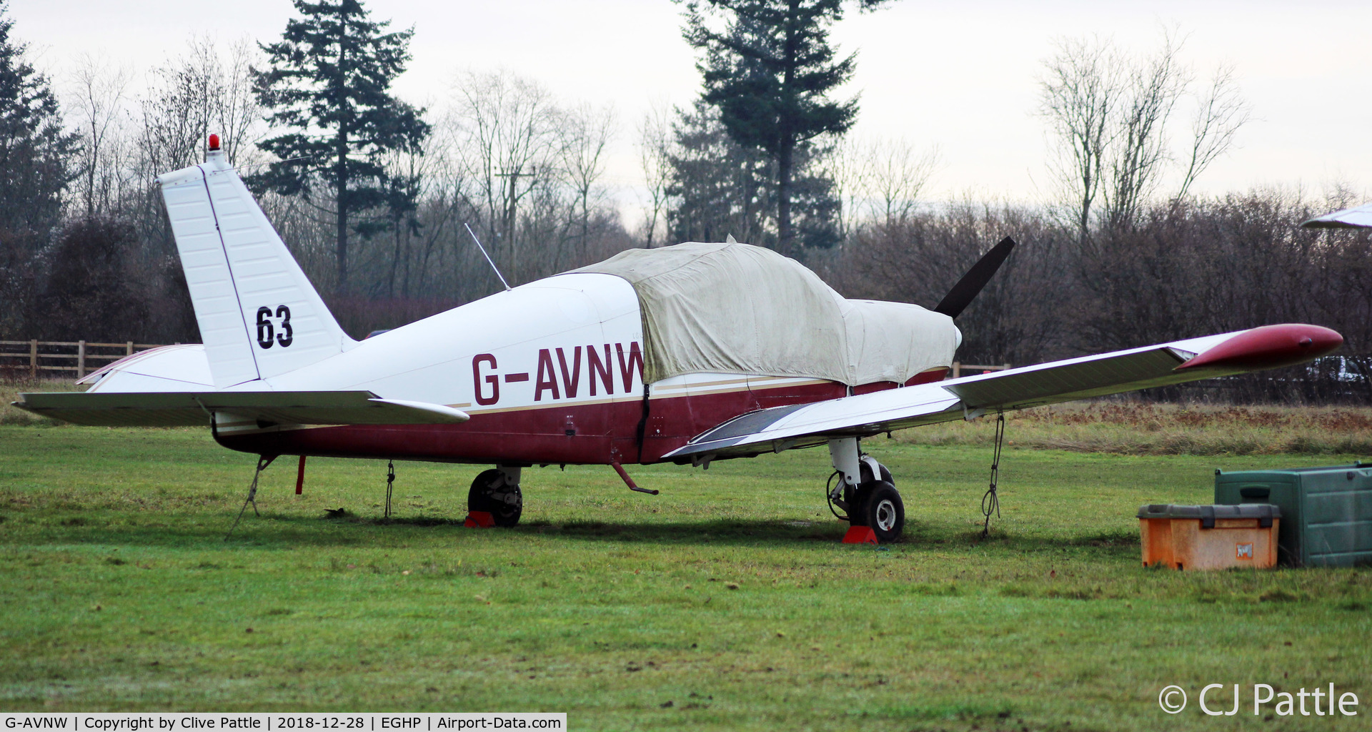 G-AVNW, 1967 Piper PA-28-180 Cherokee C/N 28-4210, Under wraps in the winter gloom at Popham