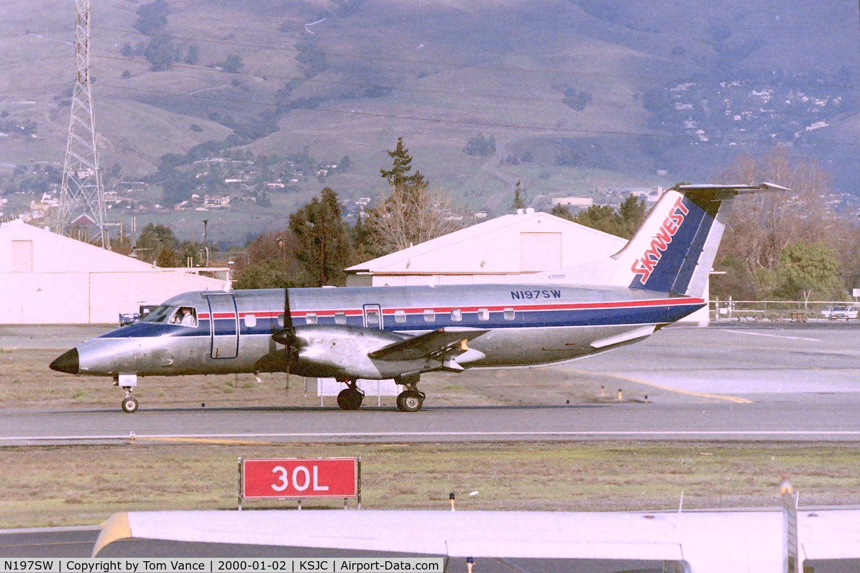 N197SW, 1990 Embraer EMB-120ER Brasilia C/N 120.186, EMB-120 at San Jose ready to depart 30L for LAX. Date apprx March 1995