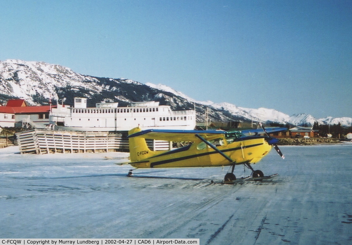 C-FCQW, 1955 Cessna 180 C/N 31115, On skis on frozen Atlin Lake at Atlin, BC.