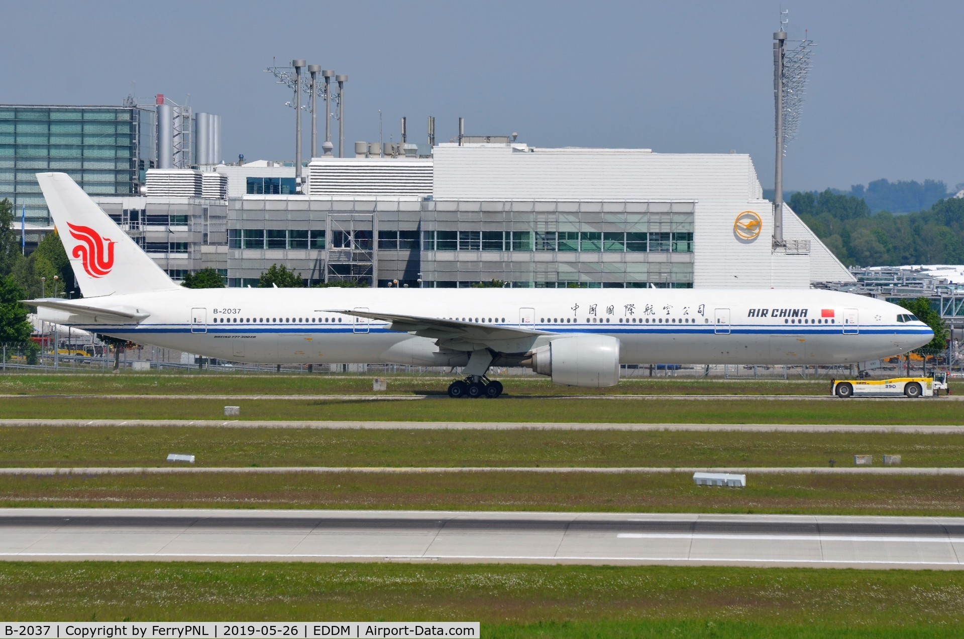 B-2037, 2013 Boeing 777-39L/ER C/N 38677, Air China B773 under tow to the gate.