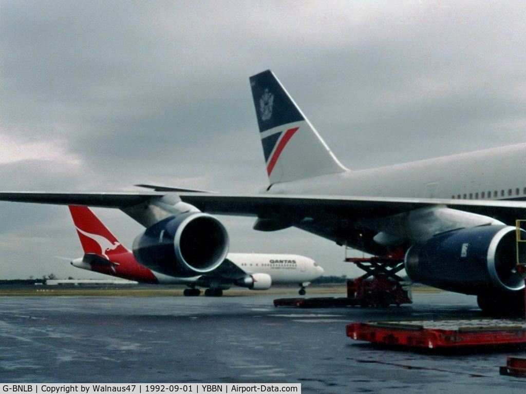G-BNLB, 1989 Boeing 747-436 C/N 23909, View of the Stbd wing, Rolls Royce engines and tail of British Airways B747-436 G-BNLB (Cn 23909, Named 'City of Edinburgh') at the 'Old Eagle Farm' International Airport YBBN on 01Sep1992. A Qantas B767-238 is taxying at rear.