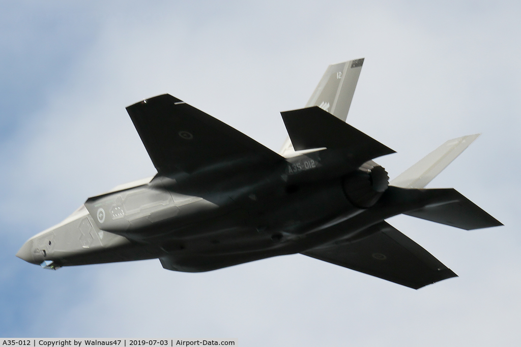 A35-012, 2019 Lockheed-Martin F-35A Lightning II C/N AU-12, Rear Port view of RAAF Lockheed Martin F-35A Lightning II A35-012 Cn AU-12, shown flying over Russell Offices Canberra ACT on the morning of 03Jul2019. The Flypast was for the Chief of Air Force ‘Change of Command’ Ceremony. (Low Res).