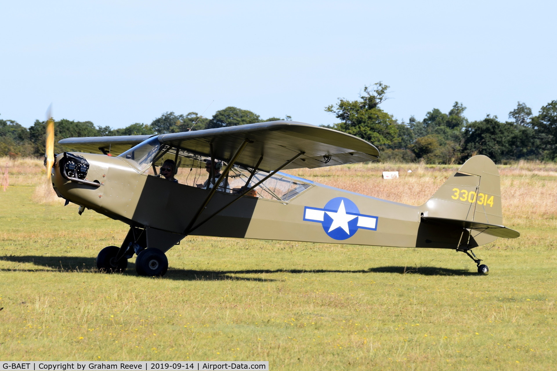 G-BAET, 1946 Piper L-4H Grasshopper (J3C-65D) C/N 11605, Just landed at, Bury St Edmunds, Rougham Airfield, UK.