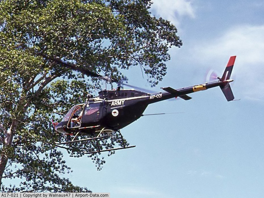 A17-021, 1974 Commonwealth CA-32 Kiowa C/N 44521, Aust Army CA-32 / Bell 206B-1 A17-021 Cn 44521 departs Igam Barracks Lae TPNG, close to a large tree in Feb 1975. Delivered 1974. Crashed 1995, after loss of Loss of Tailrotor Effectiveness (LTE) during landing at Gibb River, WA.
