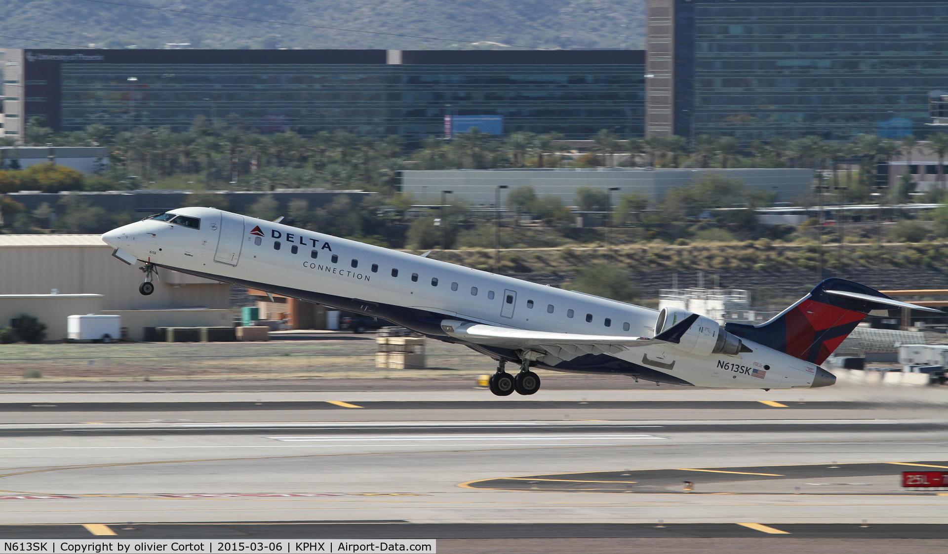 N613SK, 2002 Bombardier CRJ-701 (CL-600-2C10) Regional Jet C/N 10038, taking off from phoenix