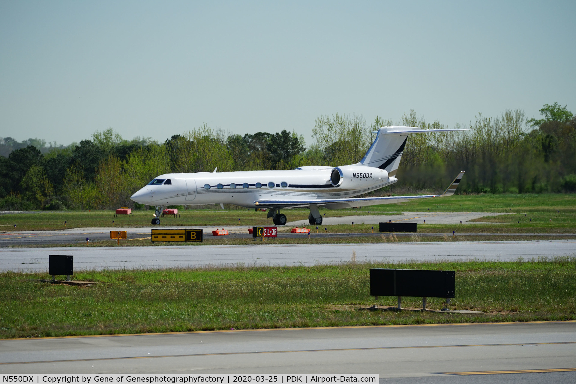N550DX, 2015 Gulfstream Aerospace GV-SP (G550) C/N 5517, Just starting its take off roll at Dekalb Peachtree Airport, today, 3/25/2020.