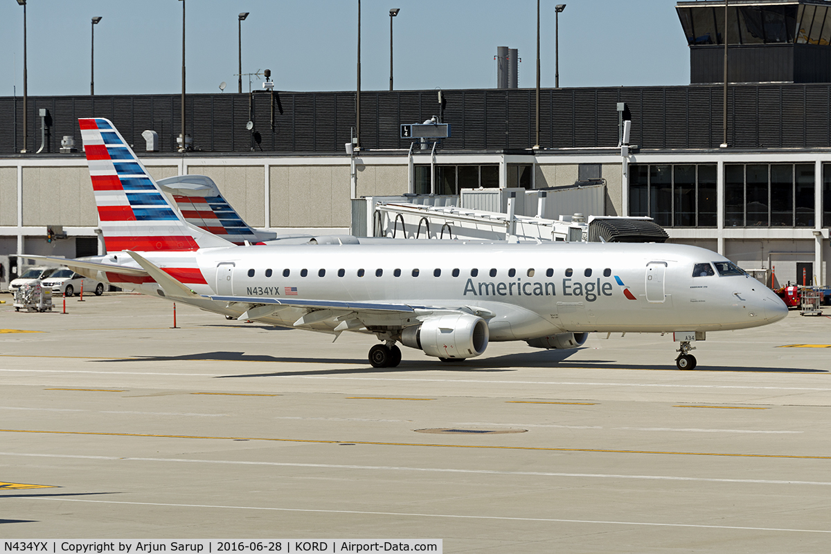 N434YX, 2014 Embraer 175LR (ERJ-170-200LR) C/N 17000418, Taxiing by at Chicago.