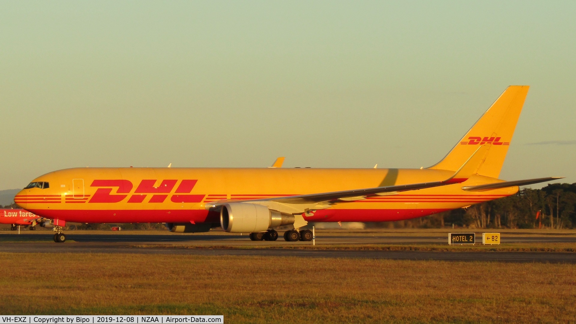 VH-EXZ, 2012 Boeing 767-3JH/F/ER C/N 37808, Taxiing out to the DHL/Tasman Cargo apron after arrival from Sydney.