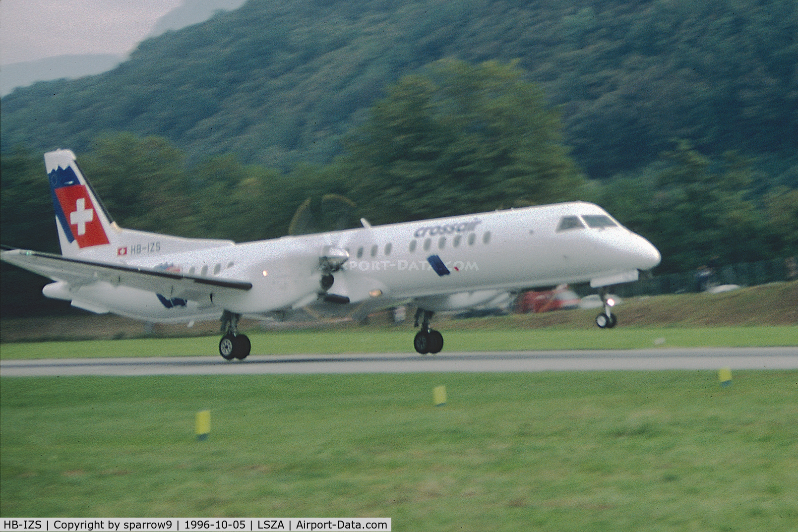 HB-IZS, 1996 Saab 2000 C/N 2000-035, Taking off from Lugano-Agno. Scanned from a slide.