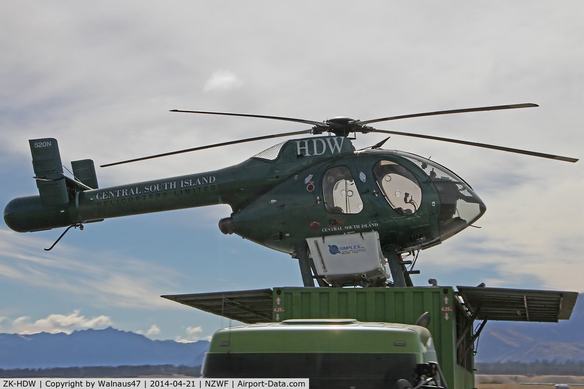 ZK-HDW, McDonnell Douglas 500N C/N LN072, Stdb side view of McDonnell Douglas 500N ZK-HSH CN LN072 at Wanaka NZWF on 21Apr2014, during Warbirds Over Wanaka (WOW) 2014. The helo is equipped with spray gear, and it operated from the roof of a large Trailer.