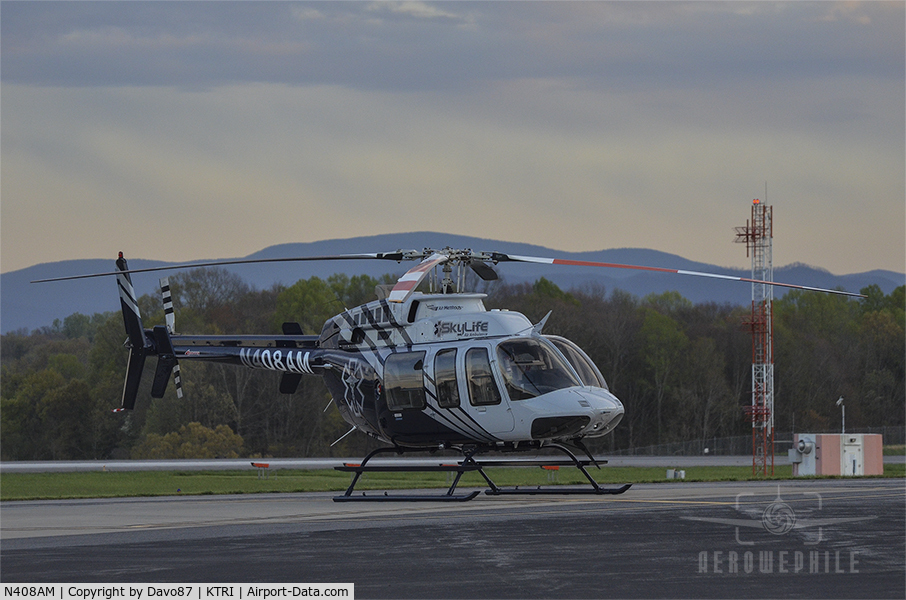 N408AM, 2000 Bell 407 C/N 53445, Parked on the ramp in front of Tri-Cities Aviation at Tri-Cities Airport (KTRI) 09Apr20
