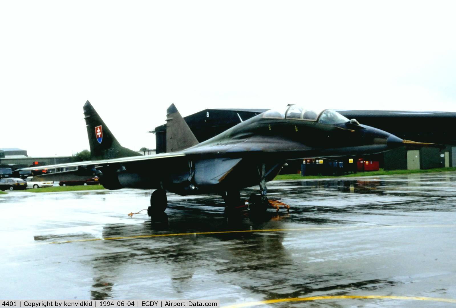 4401, Mikoyan-Gurevich MiG-29UB C/N N50903013244, On static display at the RNAS Yeovilton 1994 50th Anniversary of D Day photocall. It rained all day.