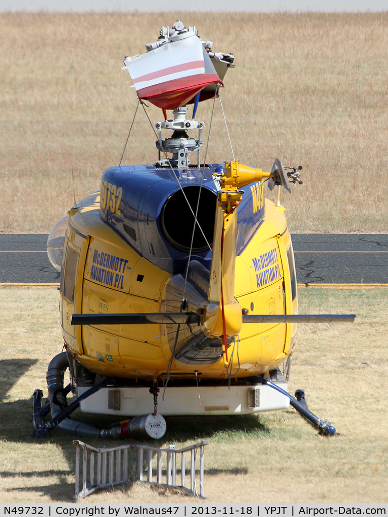 N49732, 1976 Bell 214B-1 Biglifter C/N 28005, Telephoto Rear view of McDermott Aviation Bell 214B-1 Biglifter N49732 Cn 28005 Helitack 672 parked at Jandakot Airport YPJT West Australia on 18Nov2013. Equipped with ‘under-cabin’ water tank, with ‘pick-up’ hose.