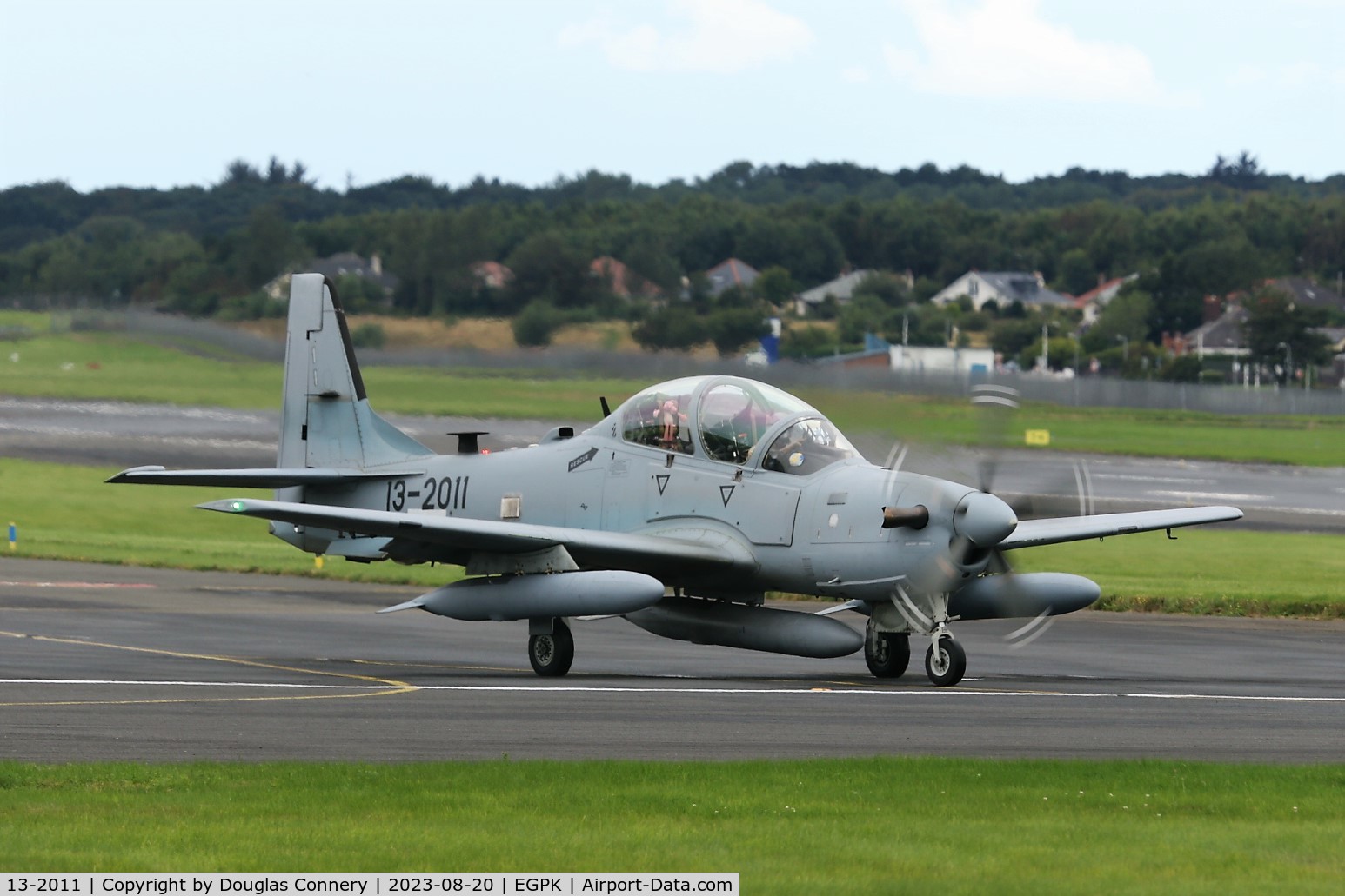 13-2011, Embraer A-29A Super Tucano (EMB-314) C/N 31400211, Afghan AF A-29 Super tucano taxiing for departure at Prestwick, did you notice the Pink Panther in the back seat?
