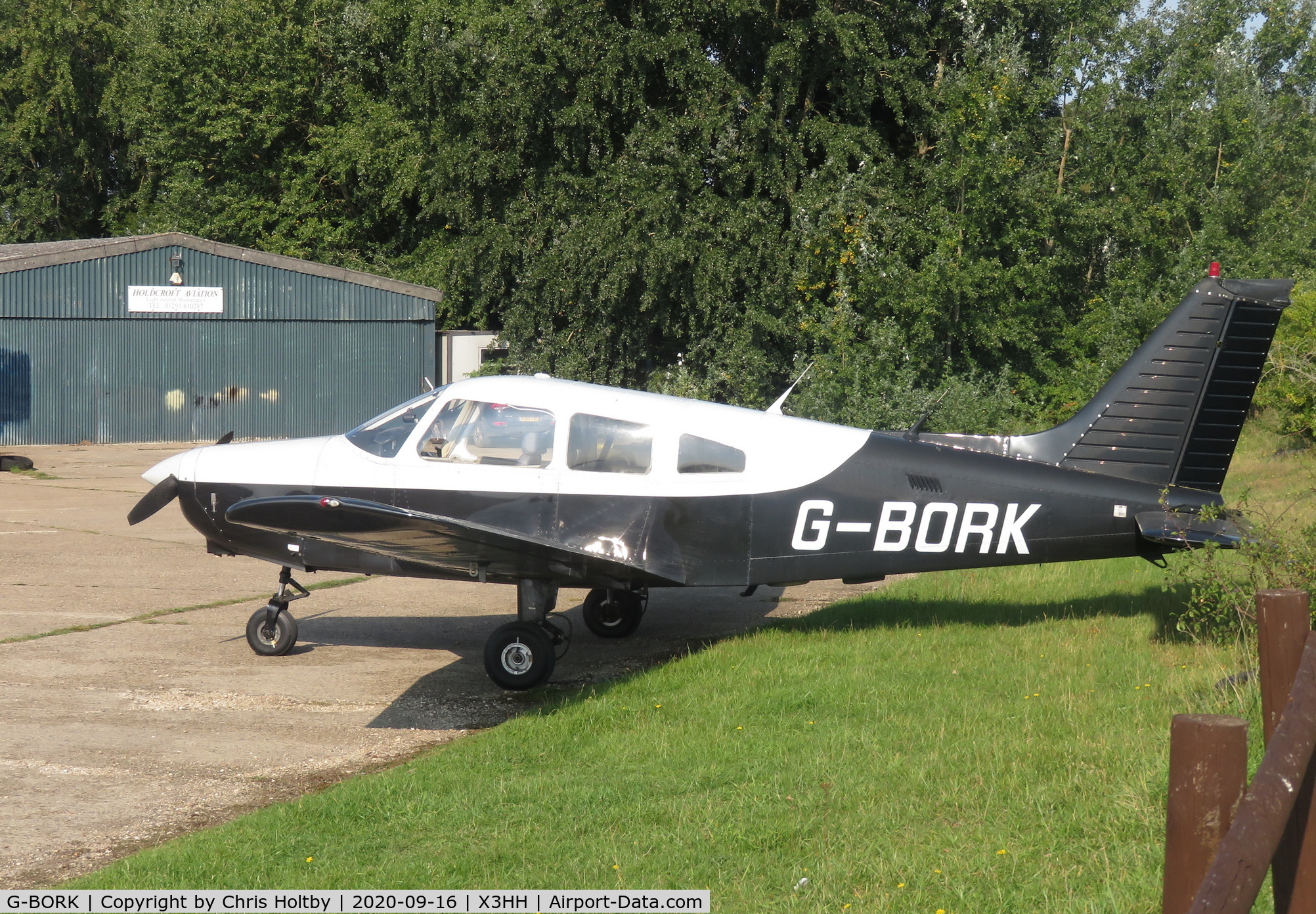 G-BORK, 1981 Piper PA-28-161 Cherokee Warrior II C/N 28-8116095, Visiting nearby airfield to its base at Turweston, parked at Hinton-in-the-Hedges