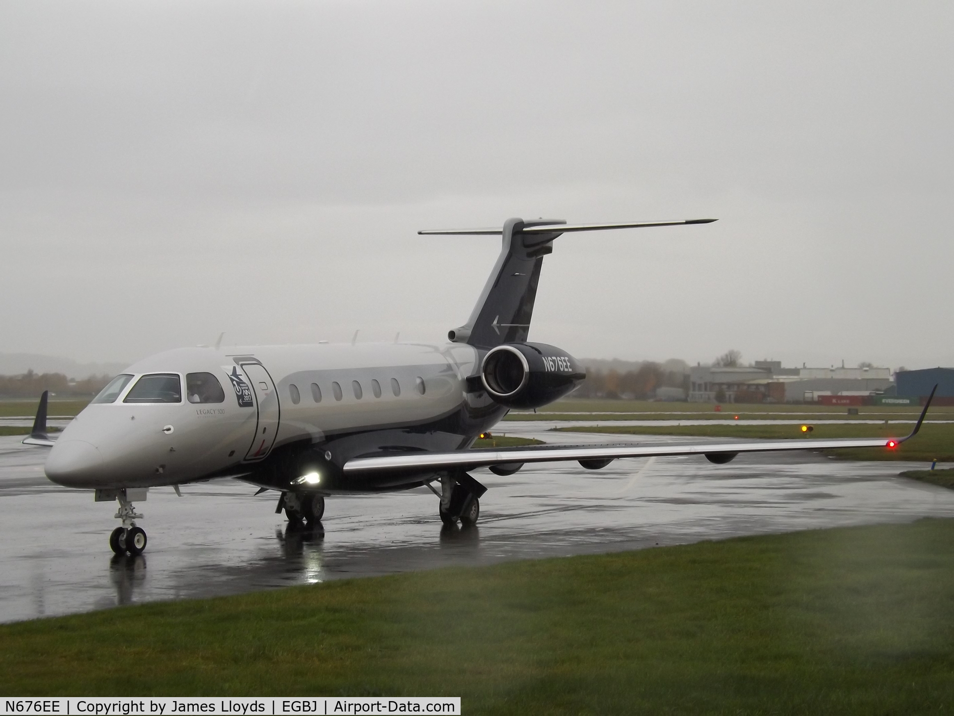 N676EE, 2018 Embraer EMB-550 Legacy 500 C/N 55000076, Taxing in at a wet Gloucestershire Airport.