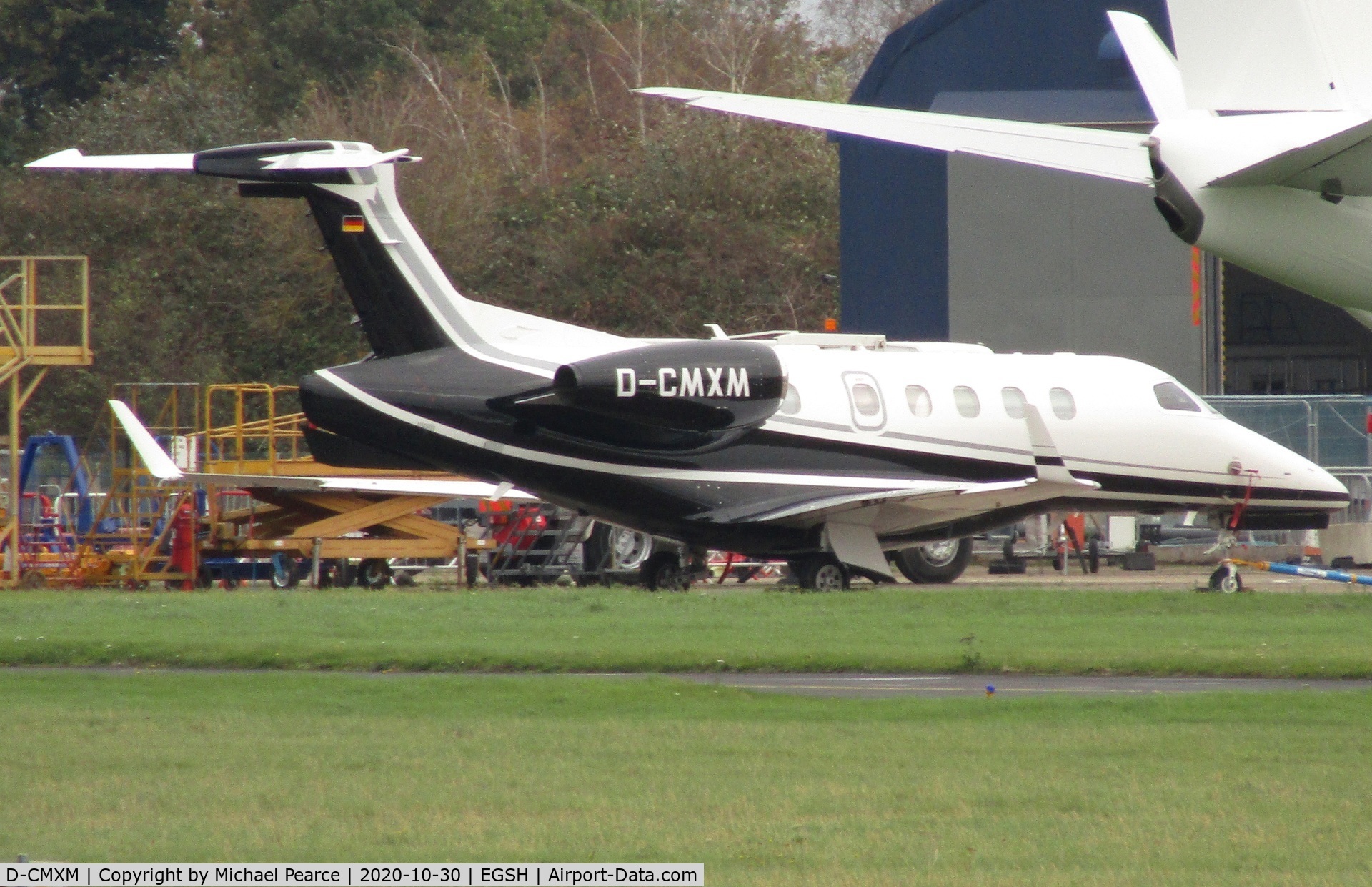 D-CMXM, 2020 Embraer EMB-505 Phenom 300 C/N 50500561, Parked on the Eastern Apron after respray. Note missing rudder.