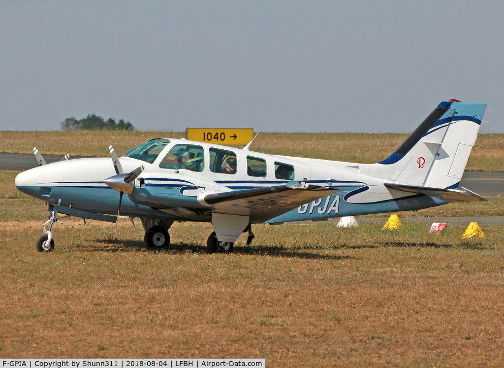 F-GPJA, 1988 Beech 58 Baron C/N TH-1532, Parked in the grass...