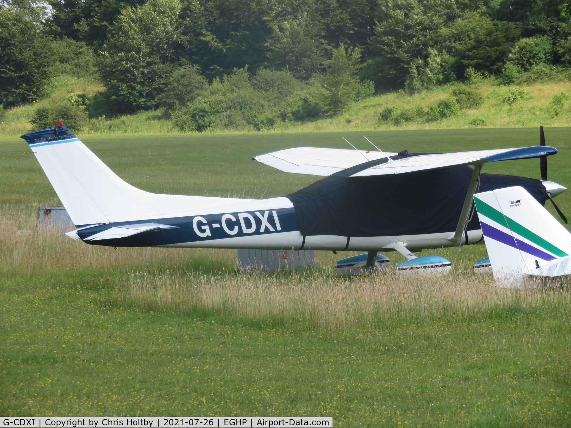 G-CDXI, 1975 Cessna 182P Skylane C/N 182-63554, Parked & covered at Popham