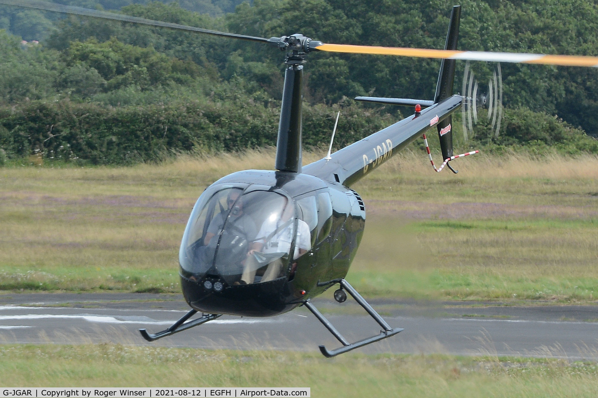 G-JGAR, 2004 Robinson R44 Raven II C/N 10513, Visiting Raven II helicopter arriving.