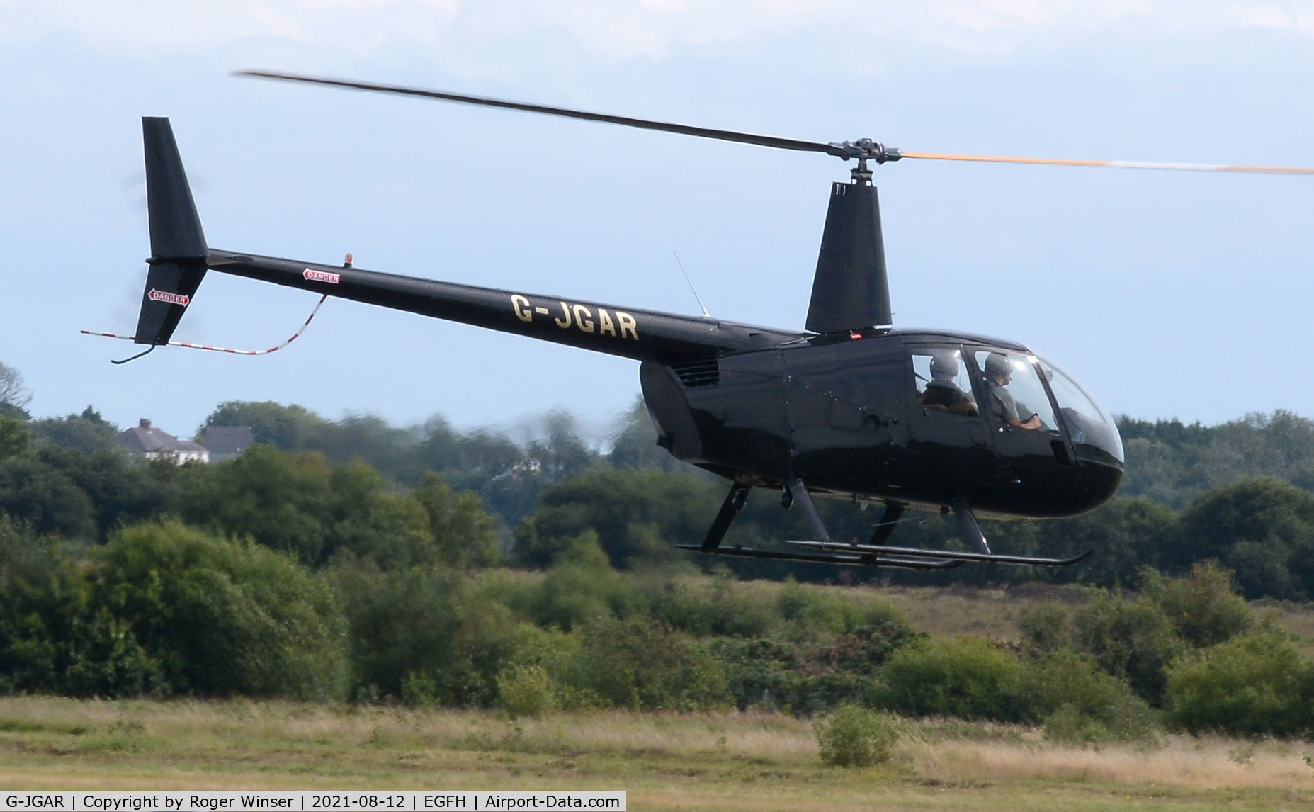 G-JGAR, 2004 Robinson R44 Raven II C/N 10513, Visiting Raven II helicopter departing.