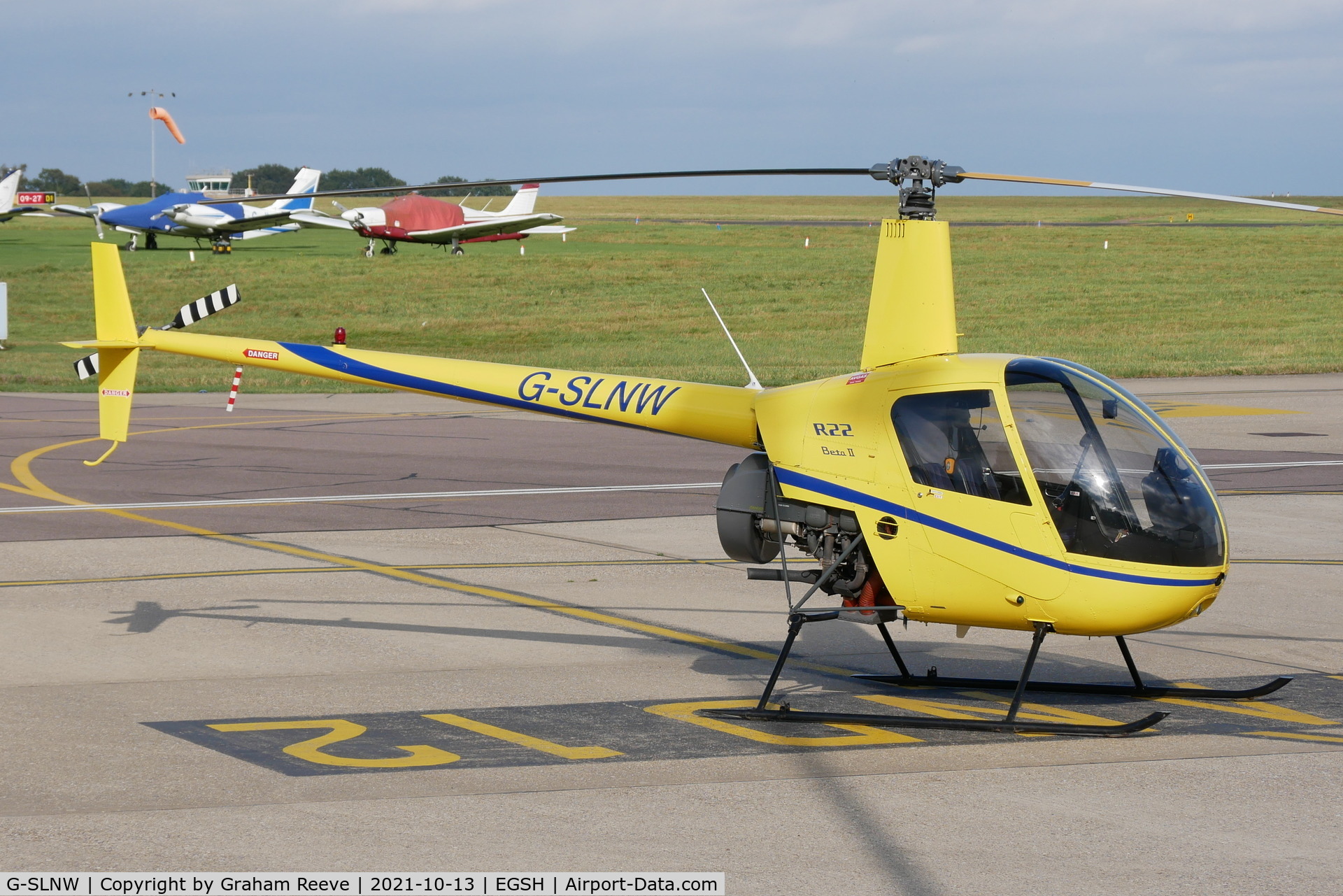 G-SLNW, 2003 Robinson R22 Beta II C/N 3524, Parked at Norwich.